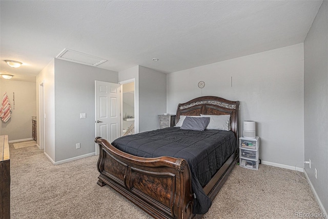 bedroom featuring a textured ceiling, carpet flooring, attic access, and baseboards