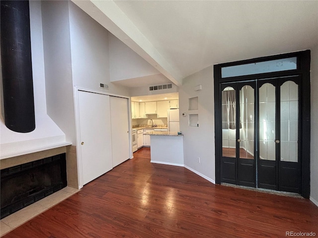 foyer with dark hardwood / wood-style floors and sink