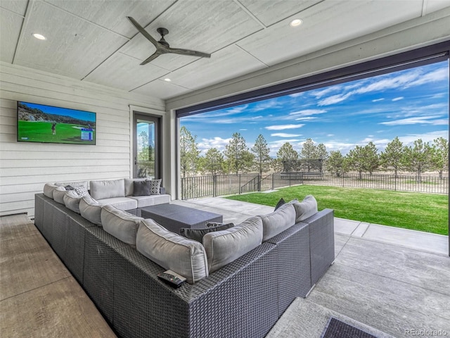 view of patio / terrace featuring a fenced backyard, an outdoor hangout area, and a ceiling fan