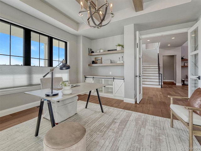 office space featuring recessed lighting, wood finished floors, baseboards, and a chandelier