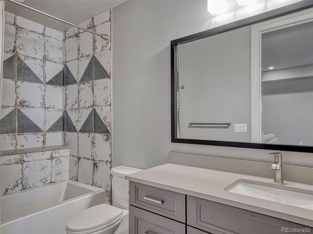 bathroom with toilet, vanity, and shower / bathing tub combination