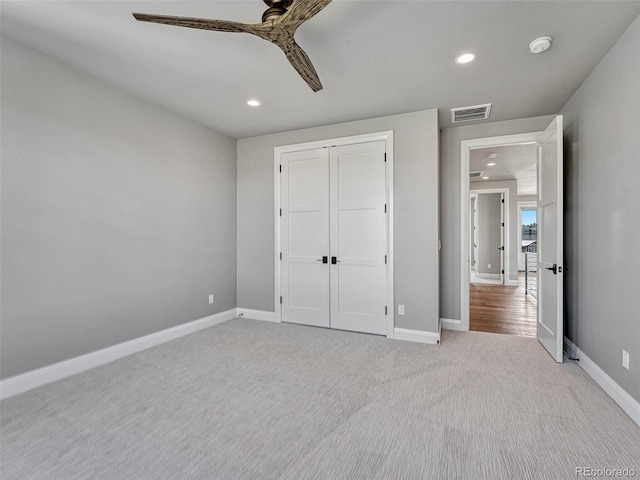 unfurnished bedroom with recessed lighting, visible vents, baseboards, and light colored carpet