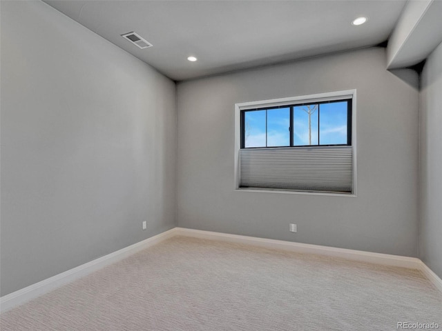 unfurnished room with recessed lighting, baseboards, visible vents, and carpet floors