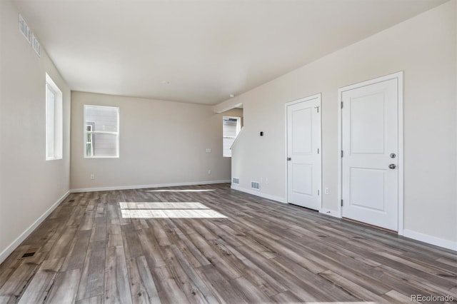 empty room with hardwood / wood-style flooring