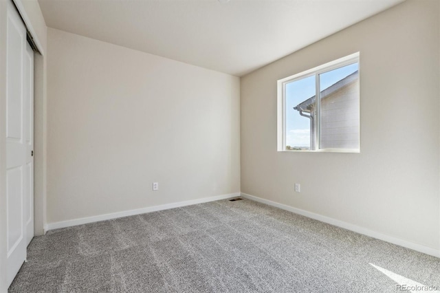 spare room featuring carpet flooring