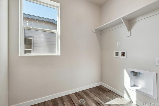 washroom with washer hookup and light hardwood / wood-style floors