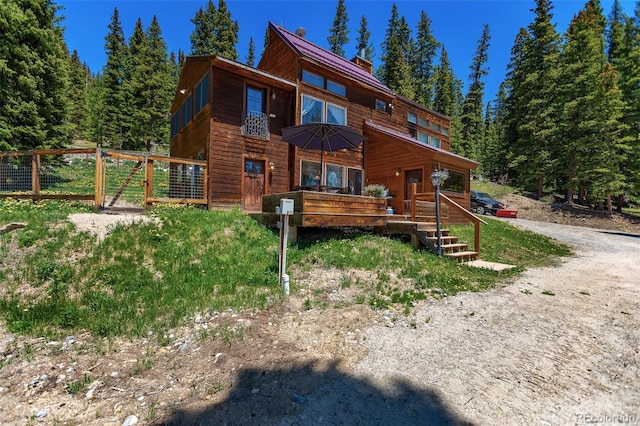 60 Jackson, Alma, CO 80420 - view of front of property featuring a wooden deck and a chimney