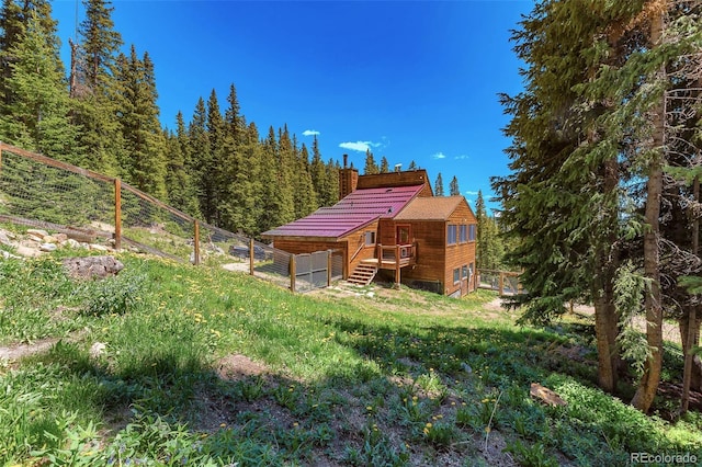 60 Jackson, Alma, CO 80420 - back of property with a deck, a chimney, and stairs