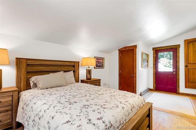60 Jackson, Alma, CO 80420 - bedroom with lofted ceiling, access to outside, baseboard heating, and light wood-style flooring