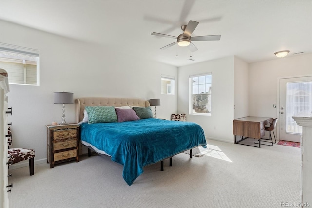 bedroom featuring ceiling fan, baseboards, and carpet