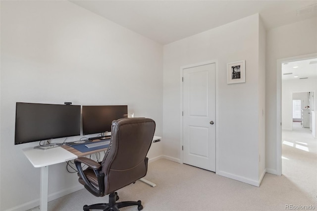 office area with baseboards and carpet floors