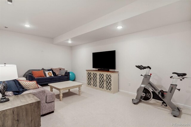 living room featuring recessed lighting, baseboards, and light carpet