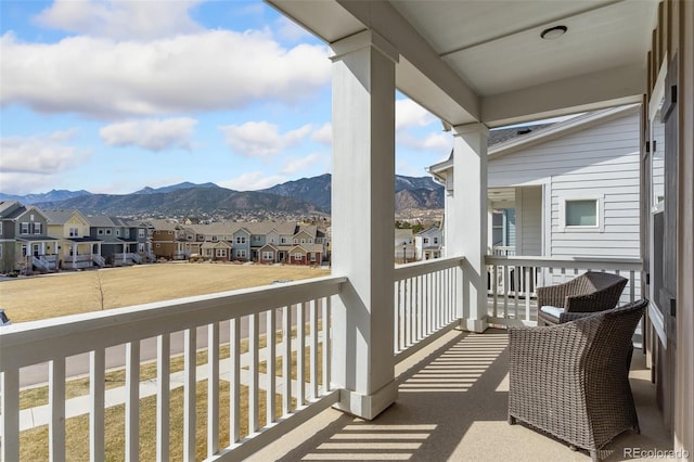 balcony with a mountain view and a residential view