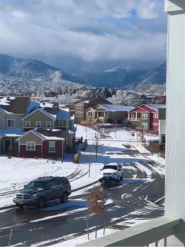 exterior space with a residential view, a mountain view, and sidewalks