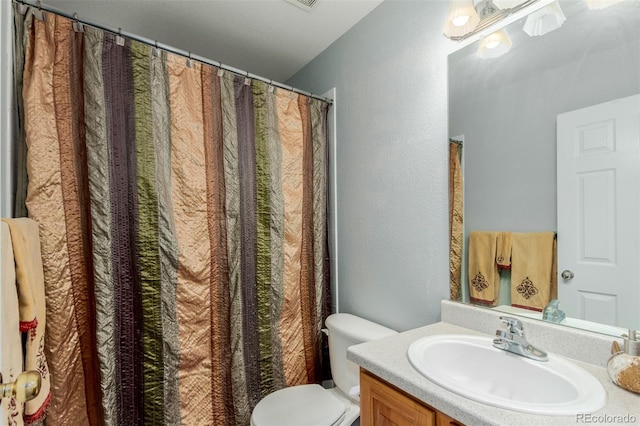 10554 Atwood Cir, Littleton, CO 80130 - full bath with vanity, toilet, and a textured wall