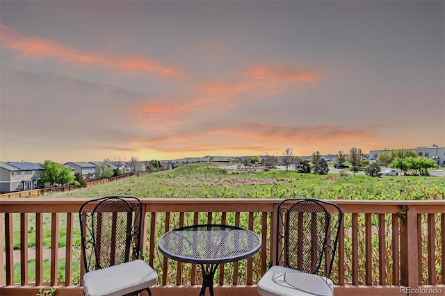 10554 Atwood Cir, Littleton, CO 80130 - deck at dusk featuring a residential view