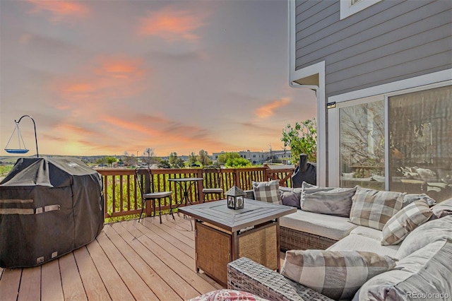 10554 Atwood Cir, Littleton, CO 80130 - wooden terrace with an outdoor living space and area for grilling