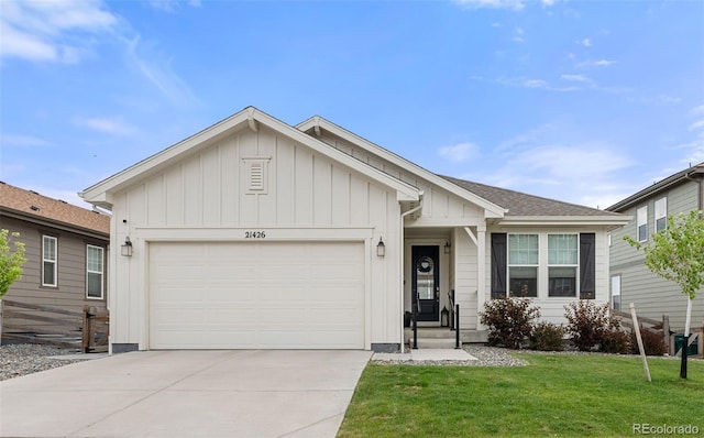 21426 E Stanford Ave, Aurora, CO 80015 - ranch-style house with an attached garage, board and batten siding, concrete driveway, and a front lawn