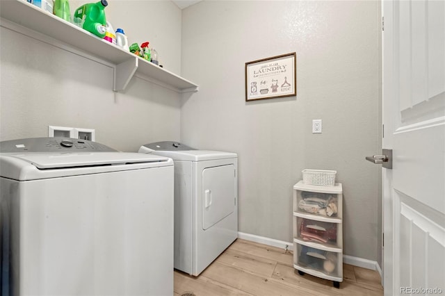 21426 E Stanford Ave, Aurora, CO 80015 - laundry area featuring washer and dryer and light wood-style flooring