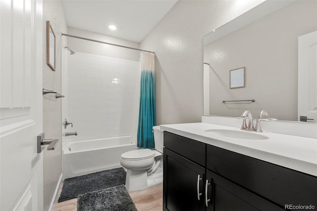 21426 E Stanford Ave, Aurora, CO 80015 - full bath featuring vanity, shower / bath combo, and wood finished floors