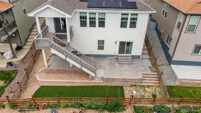 21426 E Stanford Ave, Aurora, CO 80015 - rear view of property with a fenced backyard, a patio, solar panels, and a shingled roof