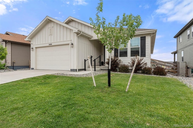 21426 E Stanford Ave, Aurora, CO 80015 - single story home with board and batten siding, an attached garage, and concrete driveway