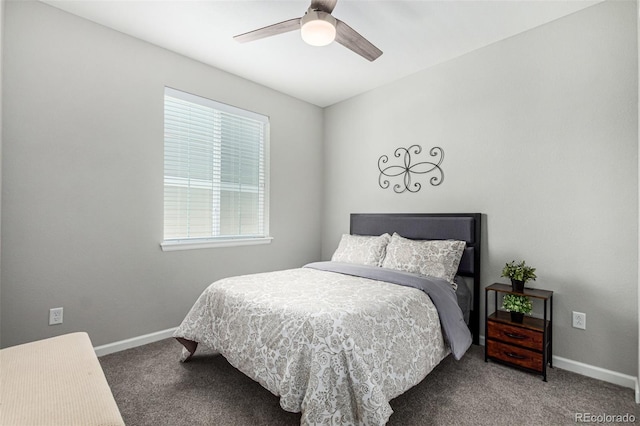 carpeted bedroom with ceiling fan and multiple windows