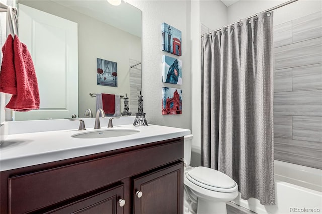 full bathroom with vanity, shower / bath combination with curtain, and toilet