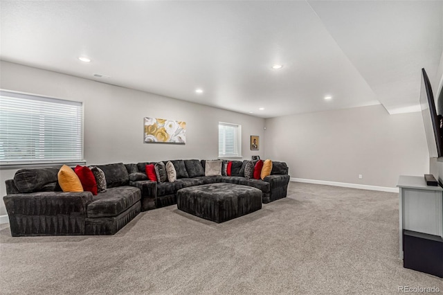 carpeted living room with a healthy amount of sunlight