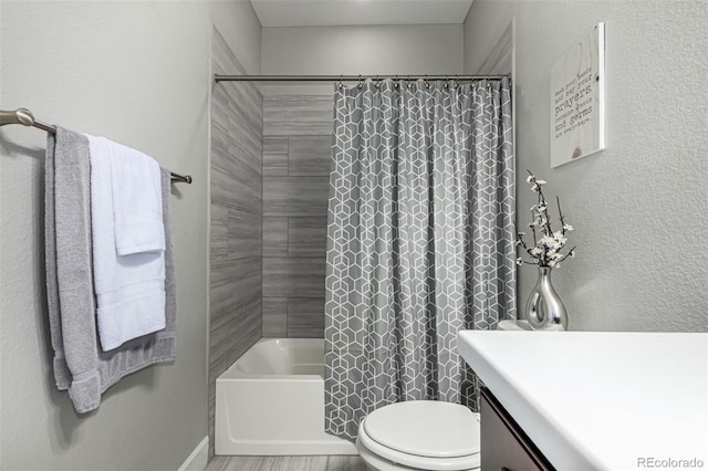 full bathroom with vanity, toilet, and shower / tub combo with curtain