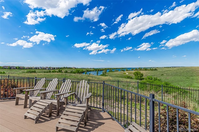 wooden terrace featuring a rural view