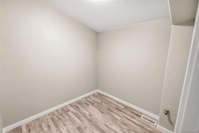 spare room with light hardwood / wood-style flooring