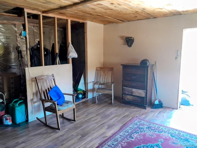 interior space featuring wood-type flooring and wooden ceiling