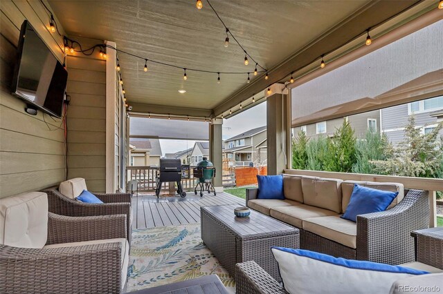 view of patio with an outdoor living space and grilling area