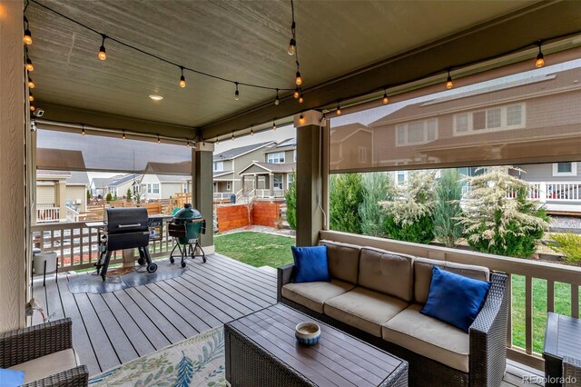 deck with an outdoor hangout area and a grill