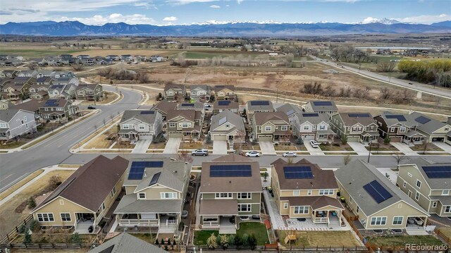 aerial view featuring a mountain view and a residential view