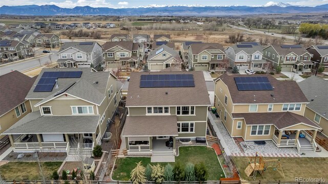birds eye view of property with a mountain view and a residential view