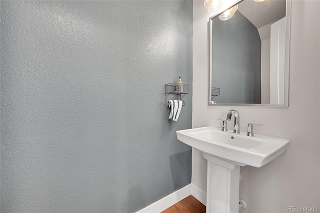 bathroom featuring sink and hardwood / wood-style flooring