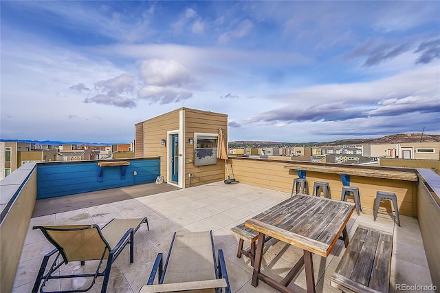 view of patio featuring an outdoor bar