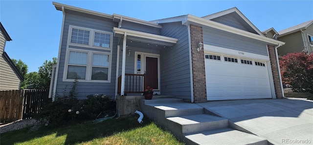 12388 Jasmine St, Brighton, CO 80602 - view of front of home with concrete driveway and an attached garage
