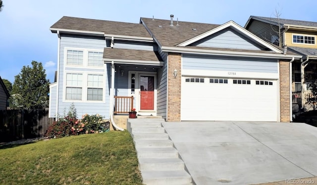 12388 Jasmine St, Brighton, CO 80602 - view of front of property with a garage, concrete driveway, and brick siding