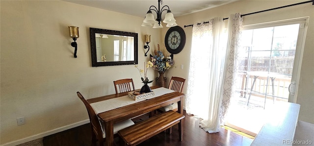 12388 Jasmine St, Brighton, CO 80602 - dining room with plenty of natural light, a chandelier, and dark wood finished floors