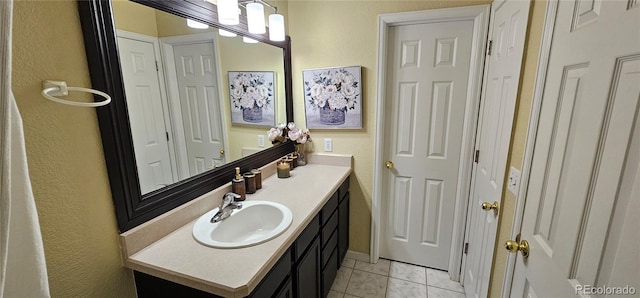12388 Jasmine St, Brighton, CO 80602 - bathroom featuring vanity and a textured wall