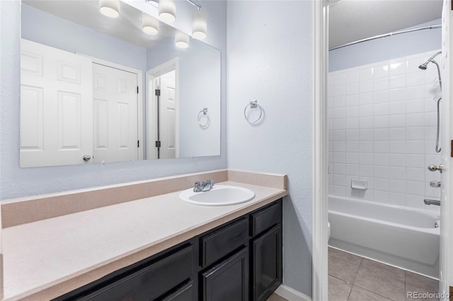 12388 Jasmine St, Brighton, CO 80602 - full bath with vanity, shower / bathtub combination, tile patterned flooring, and a textured wall