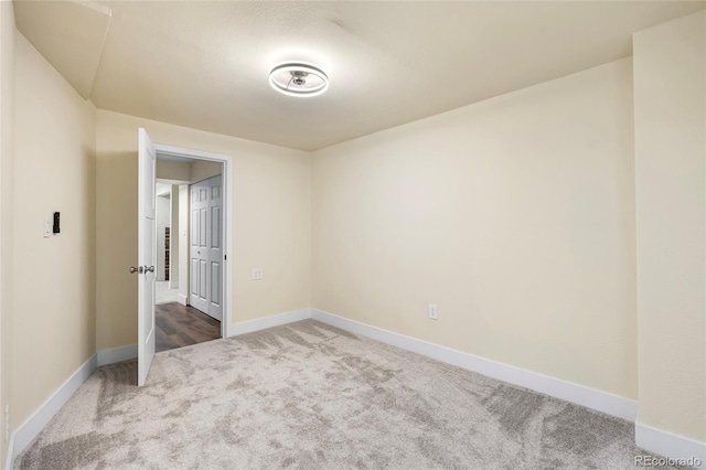 12388 Jasmine St, Brighton, CO 80602 - empty room with carpet flooring and baseboards
