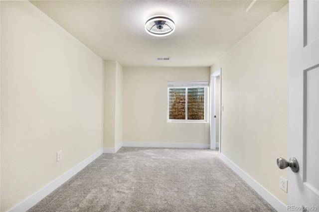 12388 Jasmine St, Brighton, CO 80602 - empty room featuring carpet and baseboards