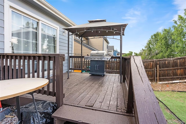12388 Jasmine St, Brighton, CO 80602 - wooden deck with a gazebo and area for grilling