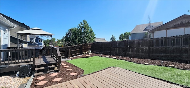 12388 Jasmine St, Brighton, CO 80602 - fenced backyard with a wooden deck and a gazebo