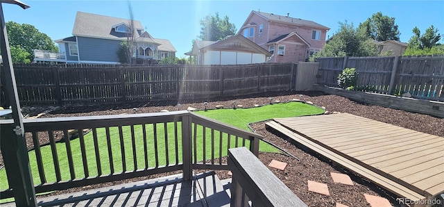 12388 Jasmine St, Brighton, CO 80602 - fenced backyard featuring a residential view and a wooden deck