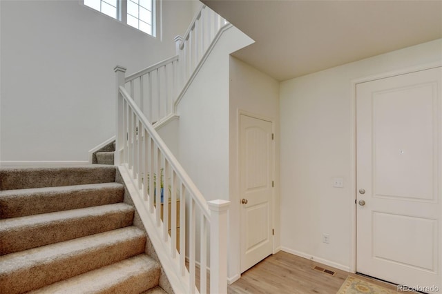 4863 Wildflower Pl, Dacono, CO 80514 - staircase with wood finished floors and baseboards